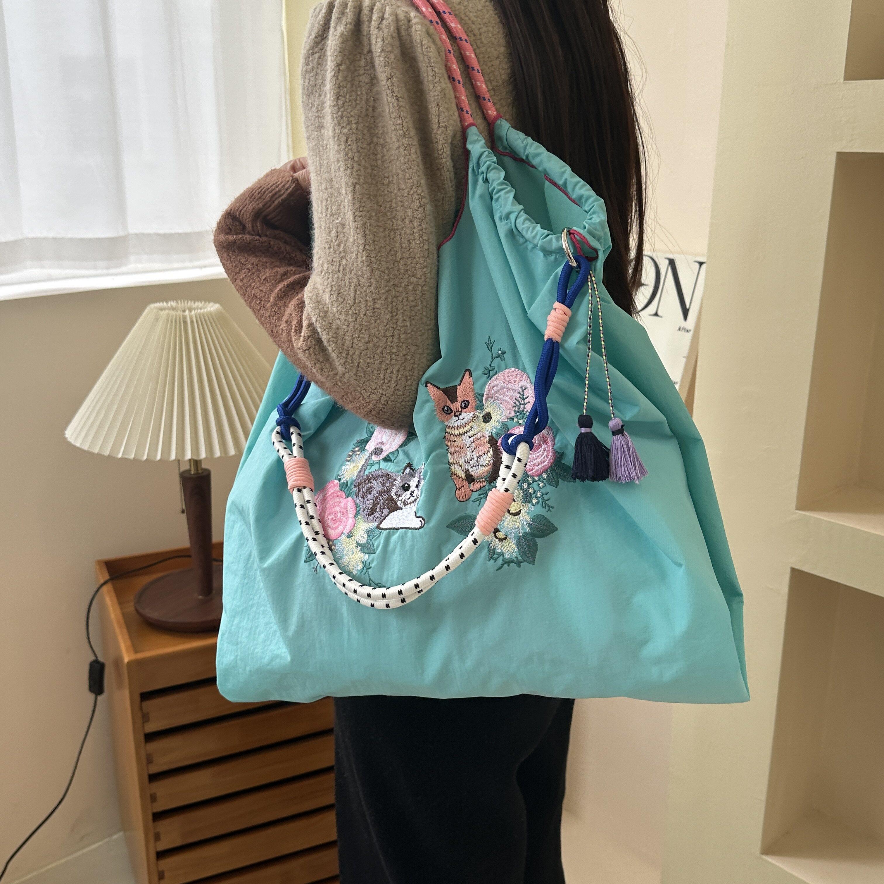包包女斜挎包2025新款高档大气尼龙包刺绣环保购物袋手拎旅行袋