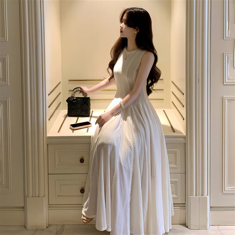 一罐杏仁桃秋冬新款米白色珍珠肌理棉纱背心连衣裙收腰大摆长裙子