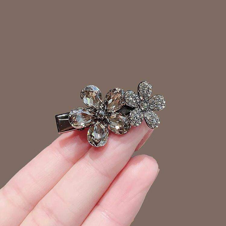 黑色仿水晶水钻花朵刘海对夹