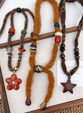 捧猫家~星星花朵毛线抽拉项链