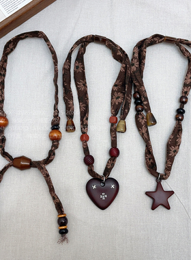 捧猫家~棕色布艺腰果花颈链