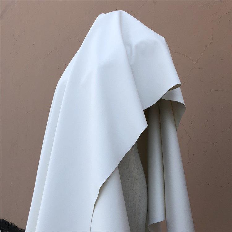 中弹力针织仿皮布-PU面料 哑光小羊皮款 本白色皮革布料/半米价