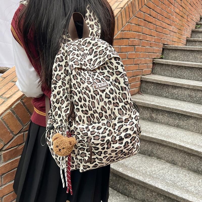 新品豹纹书包女初中生韩版高中大容量设计感双肩包小学生轻便休闲