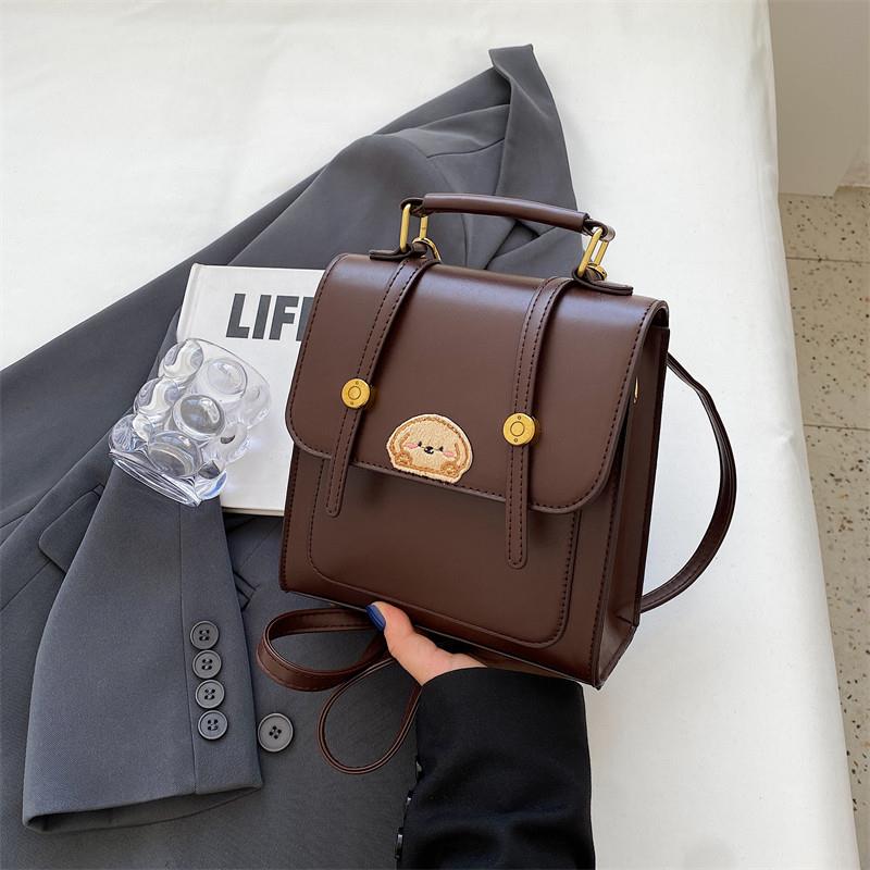 新品韩版撞色时尚手提小包包女2025新款学生上课双肩包卡通小熊斜