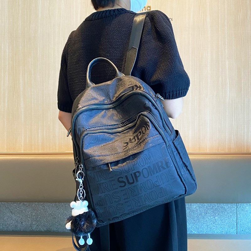 印花牛津布双肩包女2024新款时尚防水大容量轻巧尼龙旅行背包两用