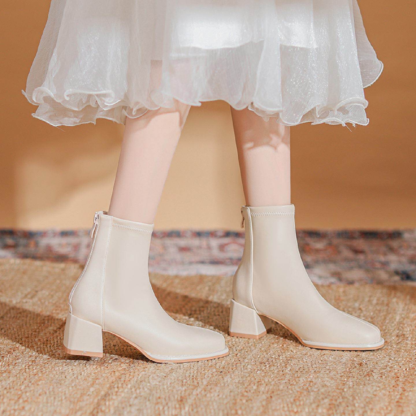 真皮白色高跟短靴女2025秋冬加绒保暖防滑增高粗跟瘦瘦软底马丁靴