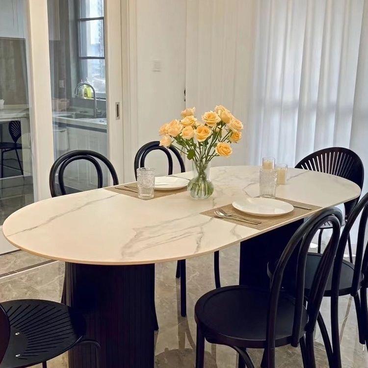 现代简约黑色椭圆形饭桌家用小户型餐厅轻奢网红款奶油风岩板餐桌