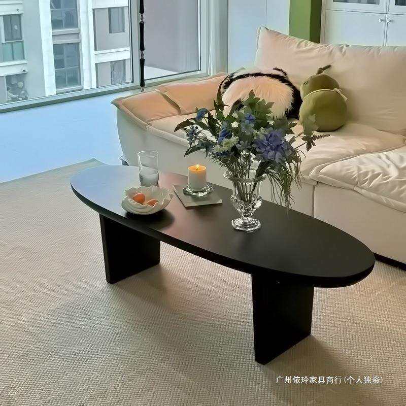 新公馆新中式黑色实木茶几椭圆形简约客厅家用小户型民宿原木桌子