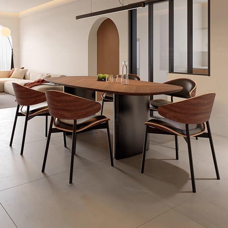 2025新款法式中古风现代简约极简椭圆形家用黑胡桃木实木餐桌椅
