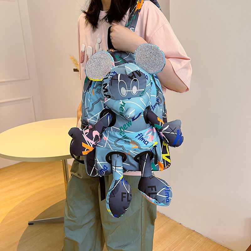 个性涂鸦双肩包女2023夏新款潮牌大容量卡通公仔书包撞色旅行背包