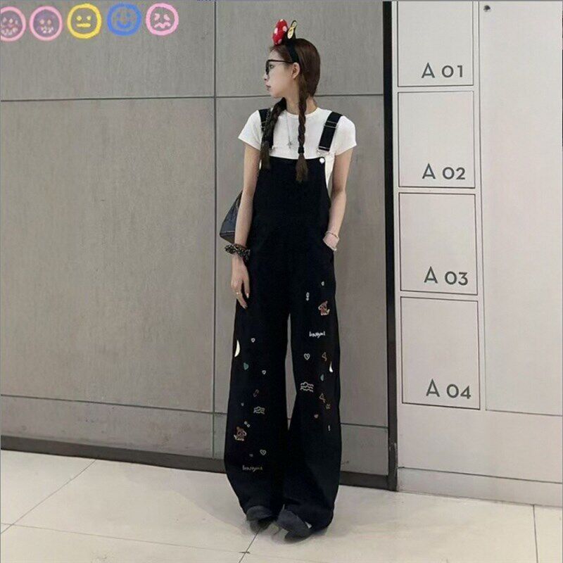 黑色重工童趣刺绣牛仔背s带裤女春夏季新款宽松显瘦连体直筒阔腿