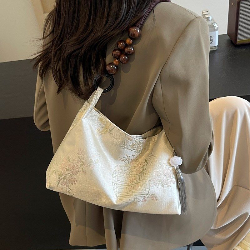 新中式国a风包包女2025新款夏季大容量通勤水桶包手提单肩腋下包,箱包皮具/热销女包/男包,水桶包,淘宝优惠券,粉丝福利购,淘宝优惠卷