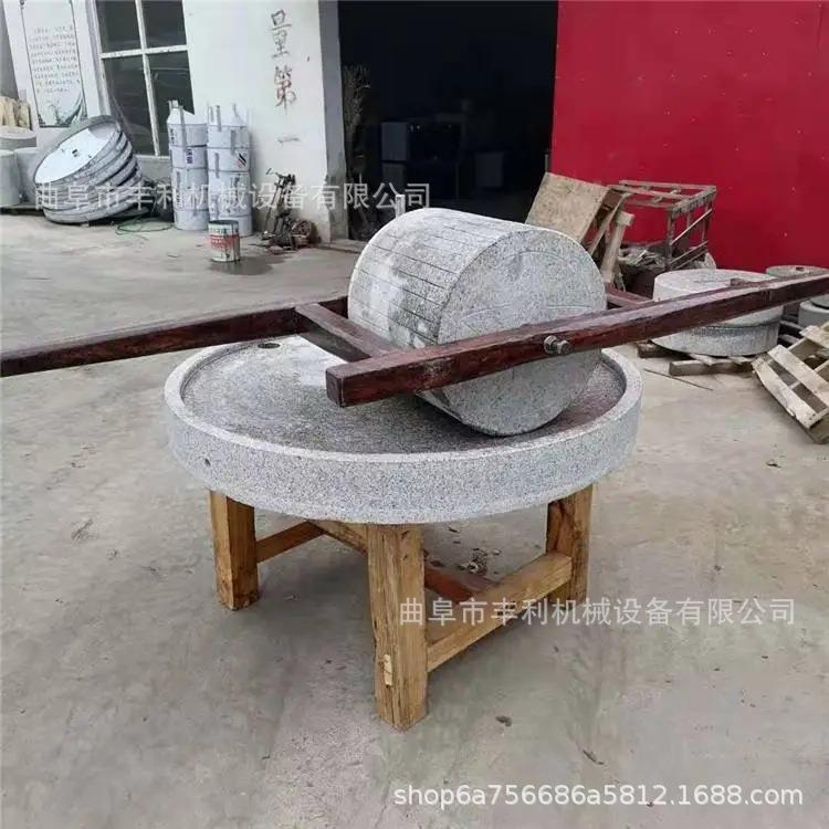 景区观赏老式手推石碾电动香油石磨五谷杂粮面粉石磨厂家