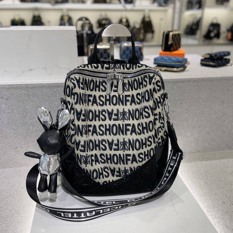 时尚帆布双肩包女2023新款潮流刺绣烫钻通勤背包高级感小众旅行包