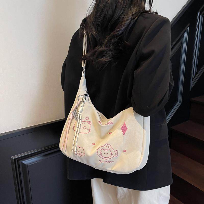 新品单肩包通勤饺子包刺绣卡通托特包2025新款斜挎包时尚休闲潮流