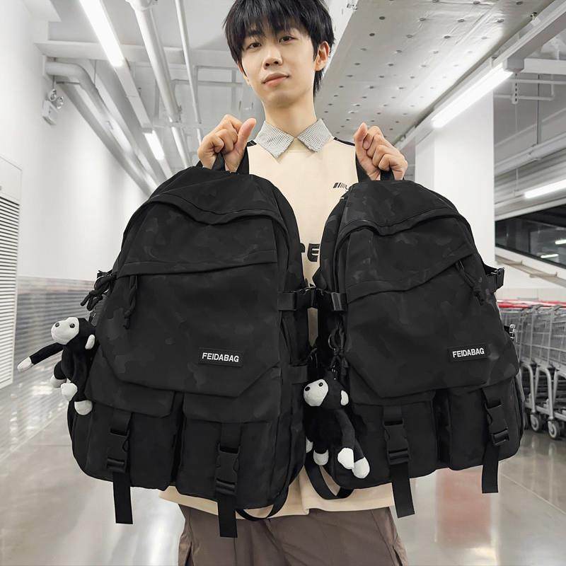 新品书包男初中生高中生大学生迷彩双肩包女生韩版小学生3--6年级