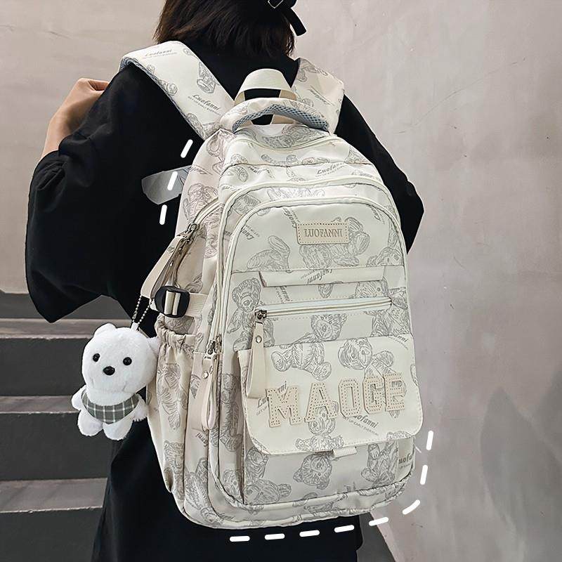 新品书包女生初中大容量多层韩版高中双肩包男大学生设计感旅行背