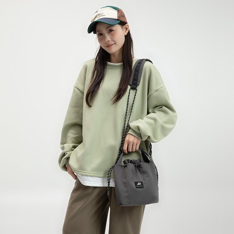 日韩抽绳轻便单肩女包手提u休闲个性多功能斜挎水桶包物品收纳小