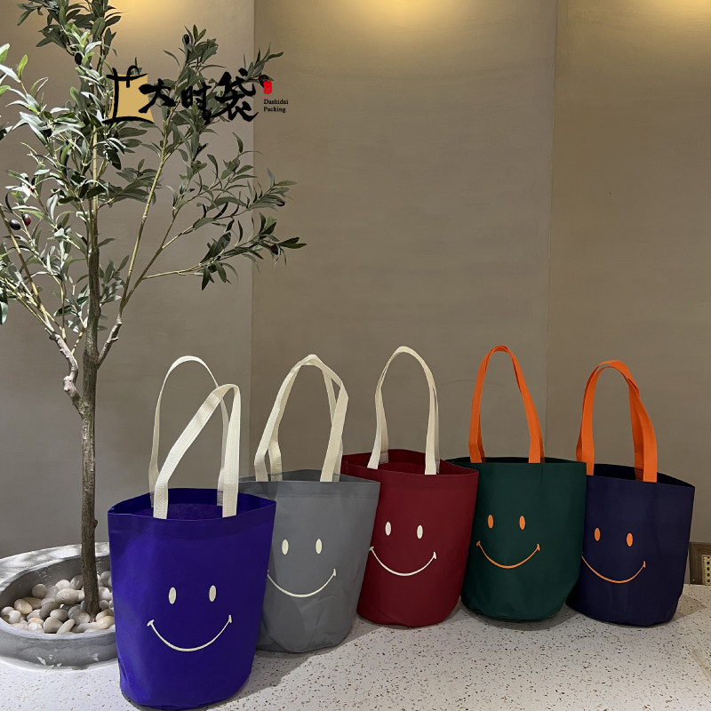 不织布笑脸水桶袋环保购物袋紫色袋子绿色礼品袋圆底袋环保袋定制,包装,无纺布包装袋,淘宝优惠券,粉丝福利购,淘宝优惠卷