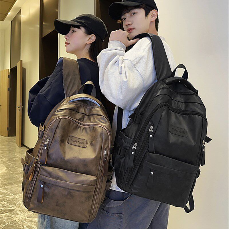 2025新款皮面中学生书包防水双肩包男女生通勤百搭大学生电脑背包