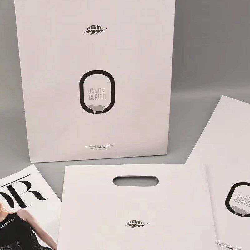 手提纸袋定制印刷logo定做服装店广告公司企业礼品袋镂空挖孔手提