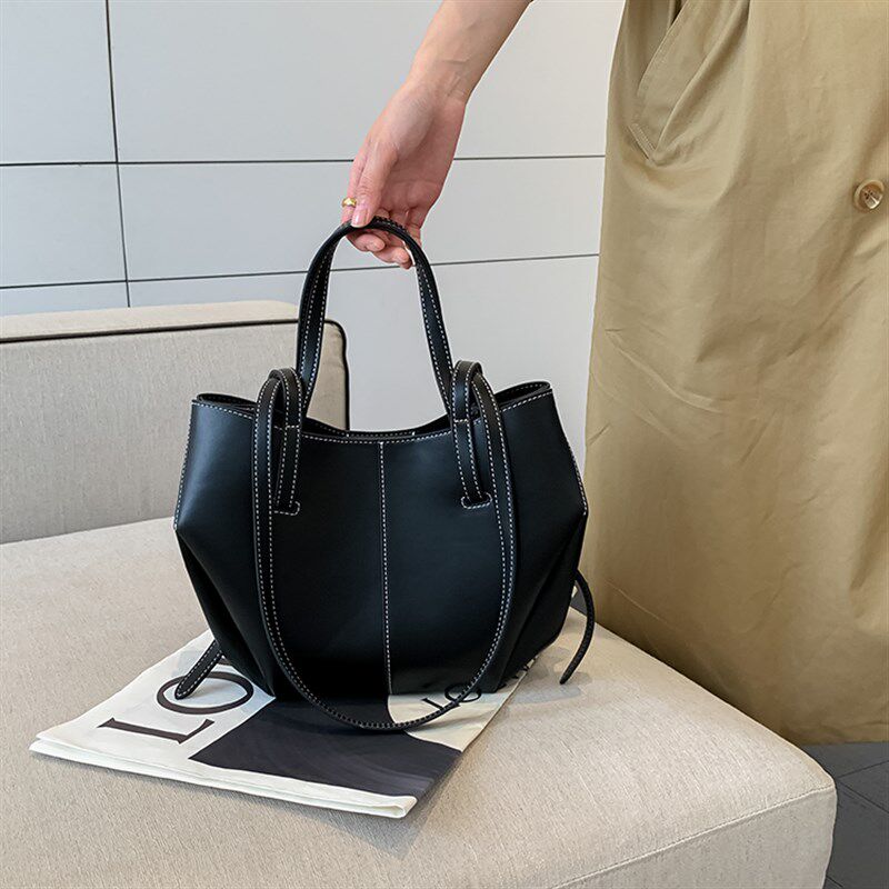 东胜小众设计感翅膀包2t023新款女包高级感不规则单肩腋下手提