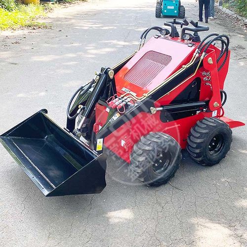 Small four-wheel tracked skid steer loader with bucket