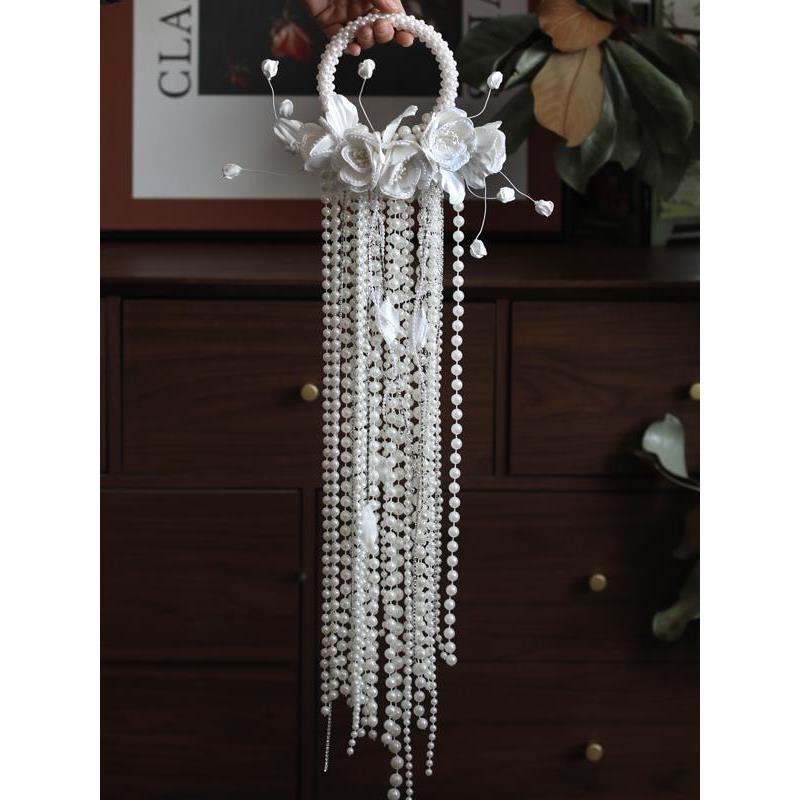 高级感珍珠瀑布手拎花婚礼新娘水滴手捧花结婚摄影珍珠手炼花束