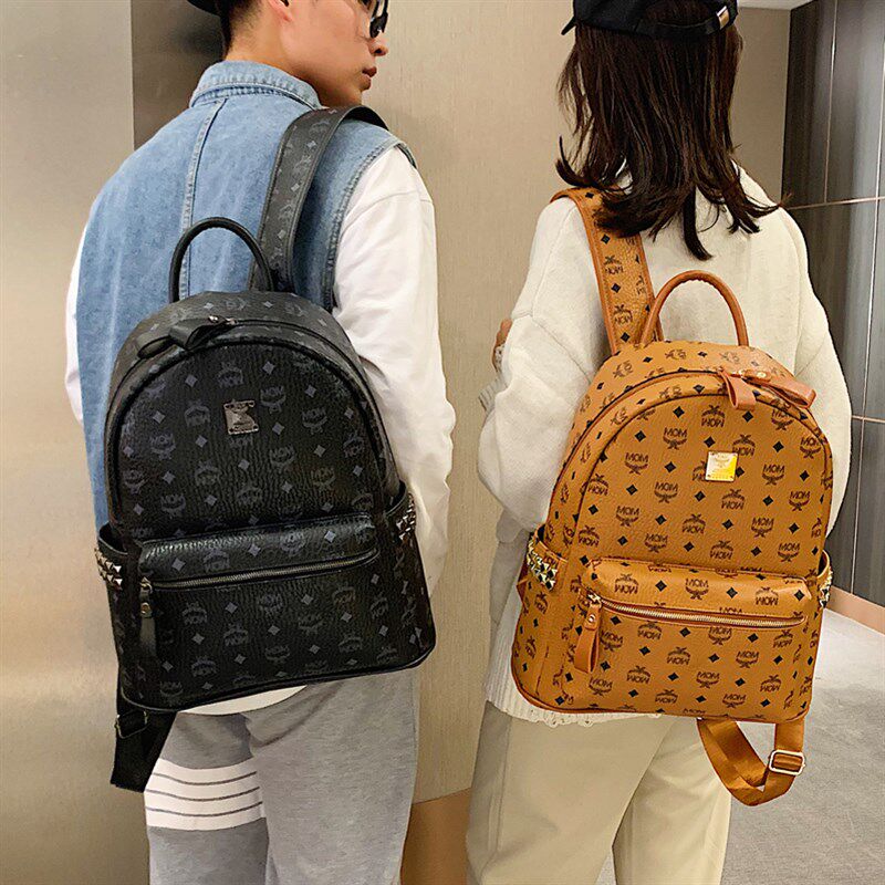 超大容量铆钉印花背包男双肩包2021年新款时尚百搭V情侣款女士书