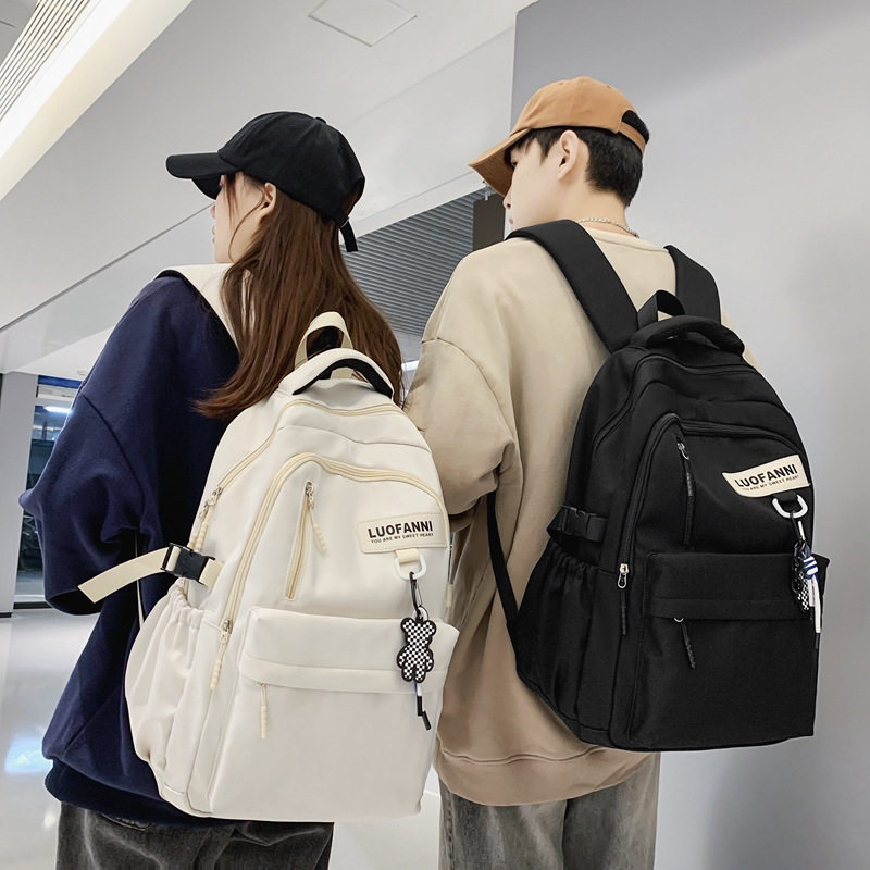 简约书包男生大学生高中生大容量女生双肩包学院风韩版情侣双肩包