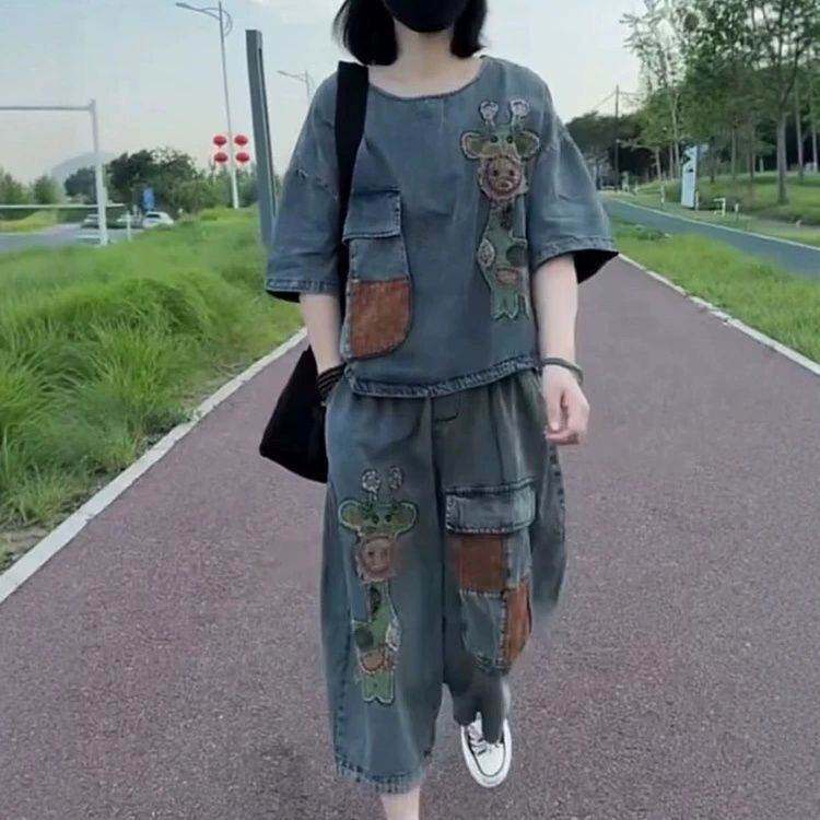 牛仔两件套装女2026年夏季新款砂洗薄款贴布卡通上衣八分哈伦裤