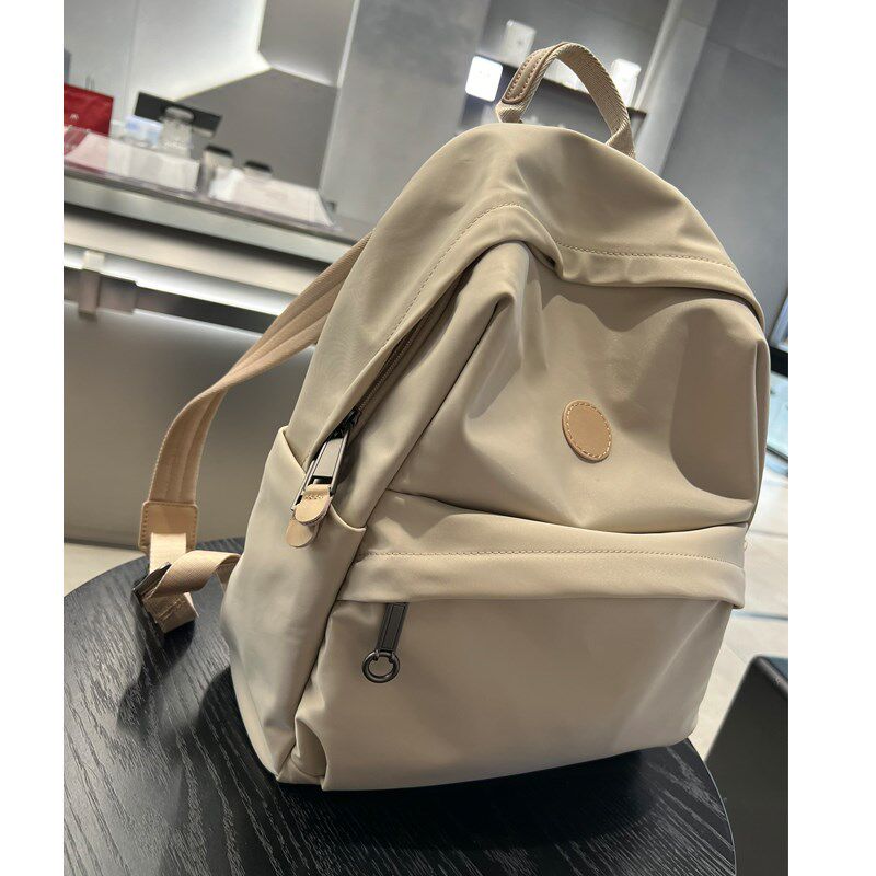 新款双肩包轻便防水背包旅游旅行双肩背包电脑包学生书包牛津纺潮