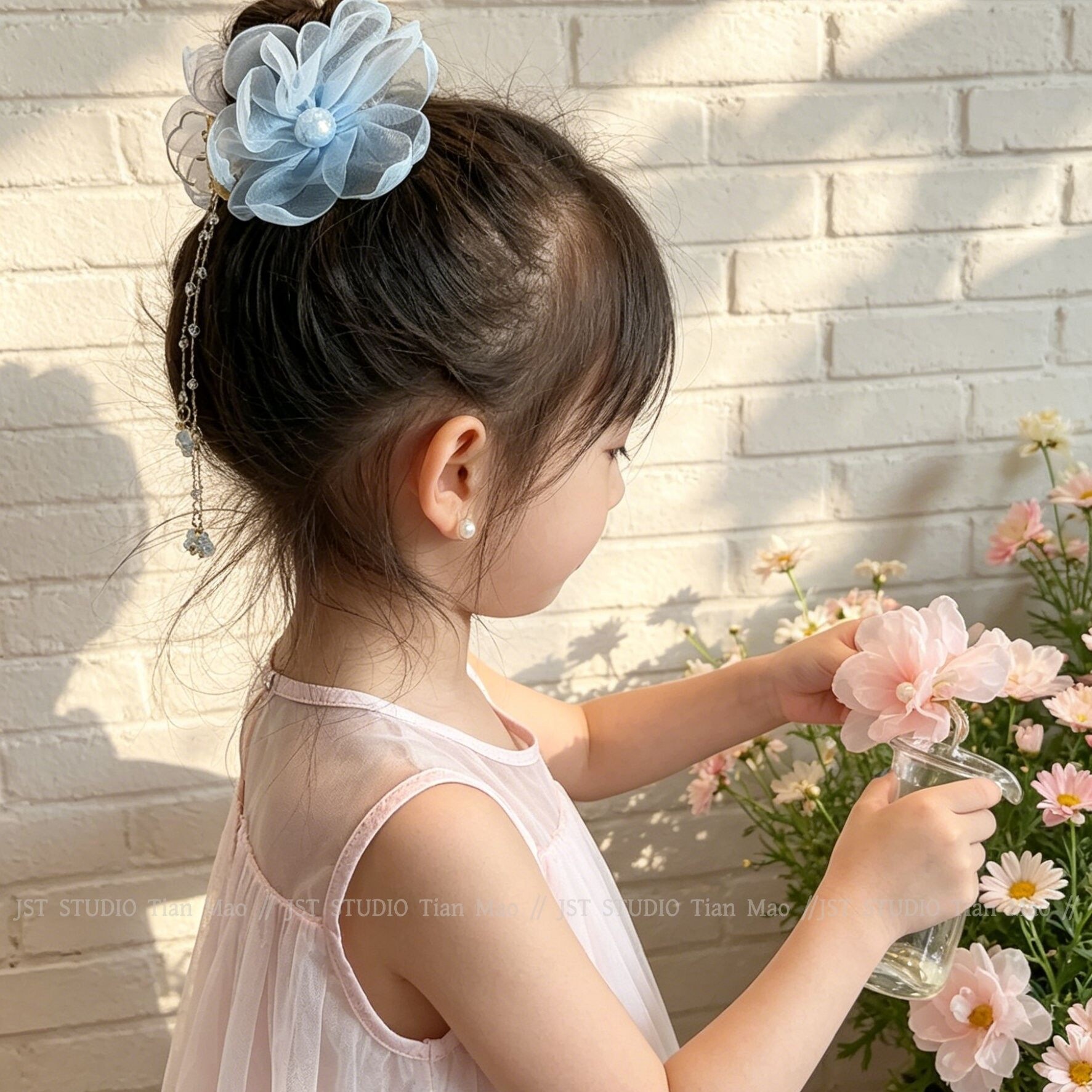 夏季女童花朵流苏丸子头抓夹图片