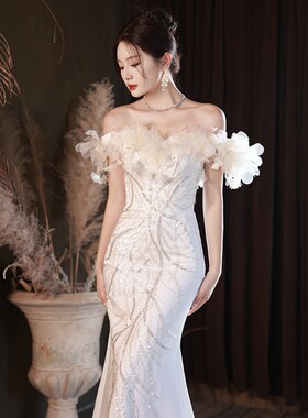 一字肩晚礼服2024新款欧美端轻奢连衣裙亮片鱼尾主持人白色礼服明