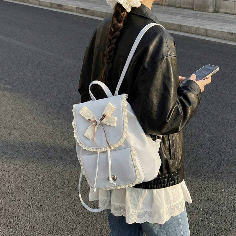 代代花枳韩版学院风女生双肩包包