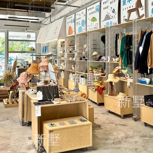 精品店货架展示架桦木流水台中岛展示台名创文创展示桌饰品展示柜