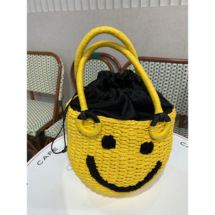 落落狷介黄色包包20o21新款包包夏小众草编水桶包百搭手提包大容