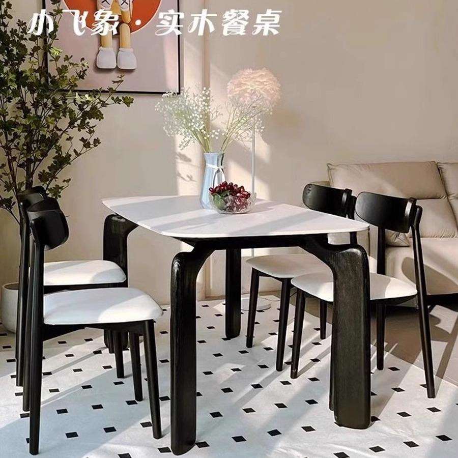 轻奢奶油风大象腿实木岩板餐桌黑色小户型现代简约新款家用饭桌