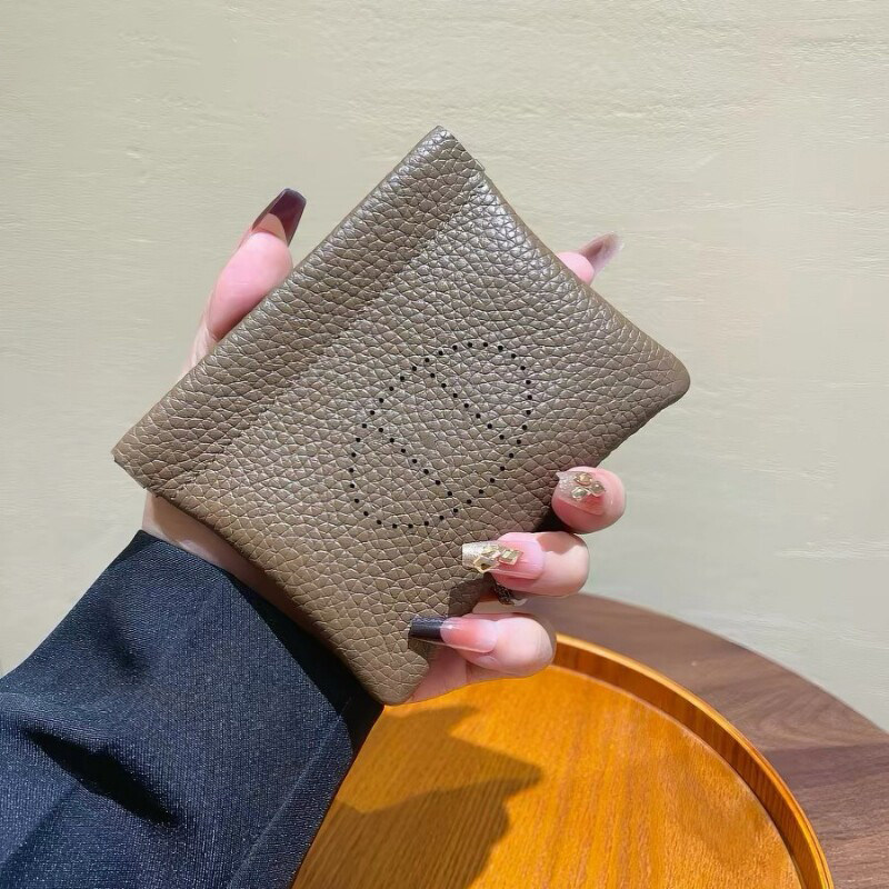 真皮荔枝纹弹片自动闭合卡包钱包图片