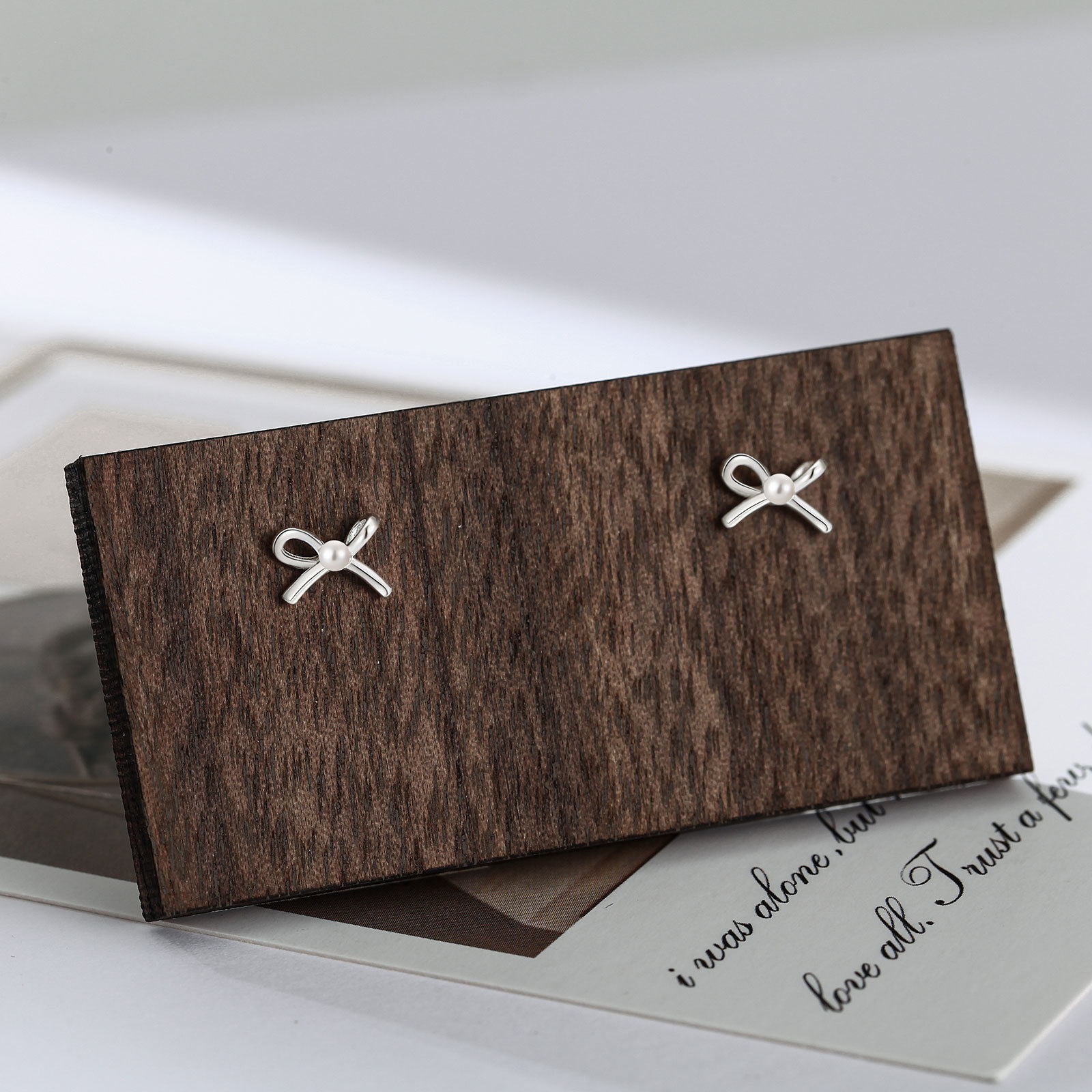 S999纯银蝴蝶结贝珠耳钉女简约气质清新网红少女耳饰养耳洞银耳环