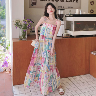 夏日多巴胺穿搭吊带裙女长款2025春夏新款法式海边度假印花连衣裙
