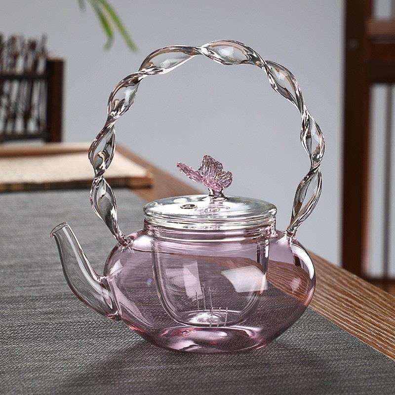 粉色扭扭把壶厂家供应高硼硅玻璃提梁茶壶电陶炉加热蝴蝶壶茶具