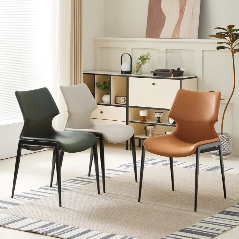 意式马鞍皮餐椅家用高级感设计师靠背扶手酒店轻奢极简餐桌狮头椅