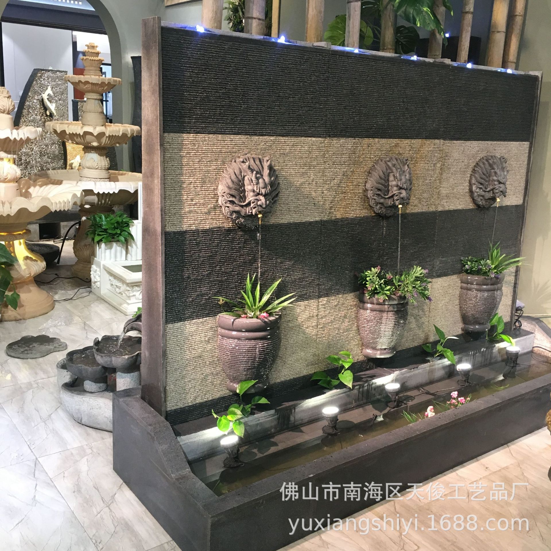 花岗岩石雕龙头喷水水幕墙景观