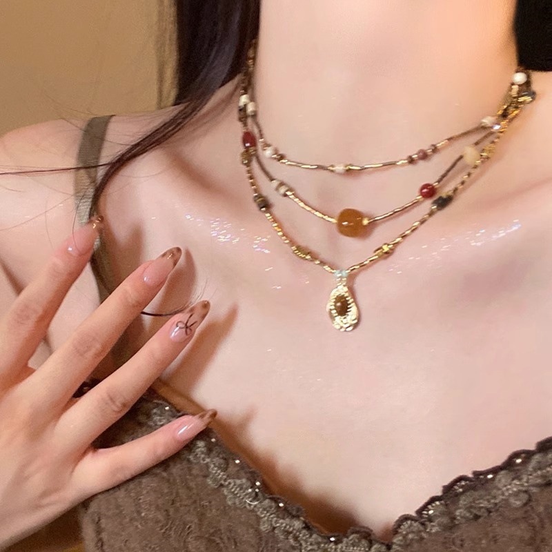 复古美式虎眼石项链女2025新款高级感毛衣链配饰轻奢小众颈链吊坠