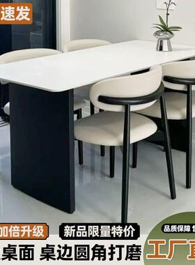 现代简约黑色岩板餐桌餐桌椅组合家用小户型长方形意式组合饭桌椅