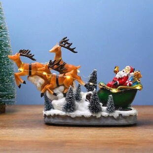 Christmas Scene Elk Pulling Cart Houses Village With Warm