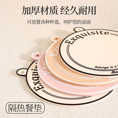 Cream-colored placemats and heat-insulating pads, designed t