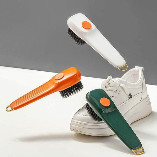 Long-handled shoe brush with soft bristles, color-contrastin
