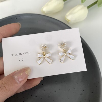 2023 New Simple Enamel White Bow Ear Clip on Earrings Female